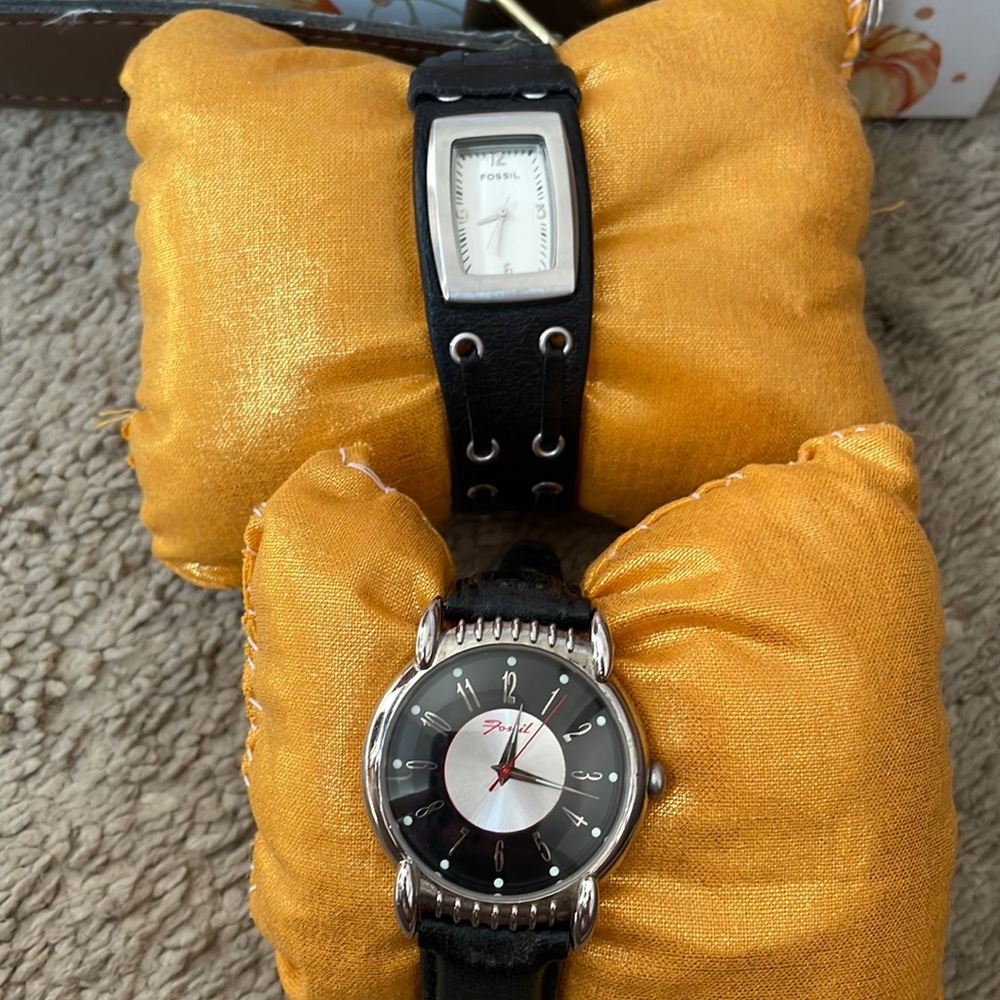2 black fossil watches